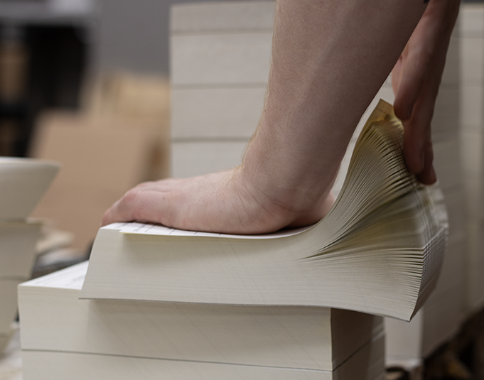 A4 3pt NCR sets being fanned apart in production
